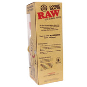 A tall cardboard box for Raw 'Doobie Dancer' rolling papers, shown standing upright on a white background. The box is natural brown kraft paper with bold red and black text and cartoon illustrations of rolling papers and a person dancing.