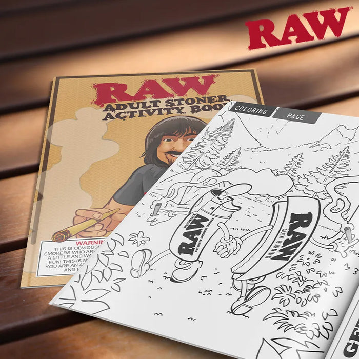 RAW Adult Stoner Activity Book with coloring page on a wooden surface